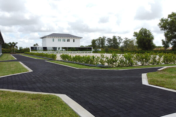 Rubber paver walkways between the barn and riding arenas