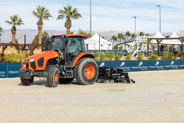 ABI Sportmaster horse arena groomer beind a tractor