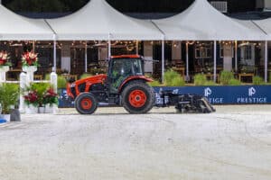 ABI Sportmaster horse arena groomer beind a tractor