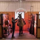 Horse underneath heat lamps in stall